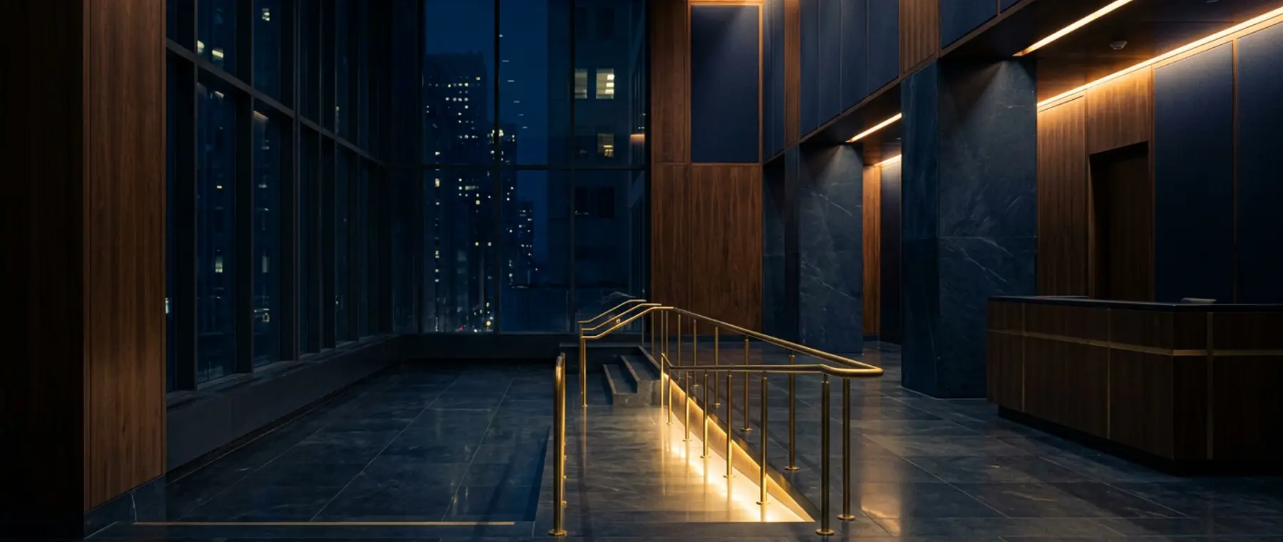 A quiet institutional lobby in navy stone and dark walnut at night